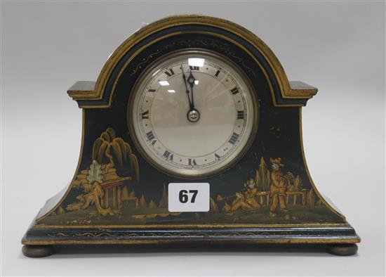 A 1920s black lacquer mantel timepiece